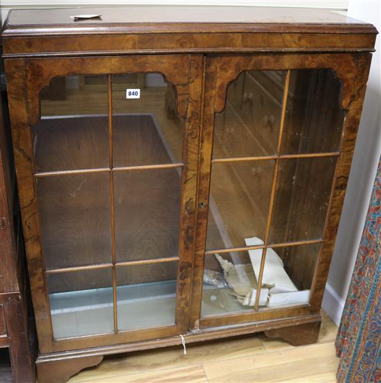 A figured walnut bookcase, W.90cm